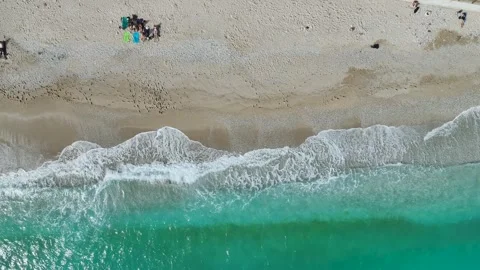 Top Down over Waves and Beach in Himare from a drone, Albanian Riviera, Albania Stockbeeldmateriaal 276139150