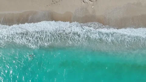 Top Down over Waves and Beach in Himare from a drone, Albanian Riviera, Albania Stock-Footage 276139211