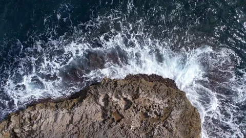 Top Down over Waves crashing on the rocks, Cliffs of Majorca, Spain, Europe Stock Footage 217439949