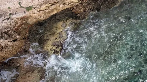 Top Down over Waves crashing on the rocks, Cliffs of Majorca, Spain, Europe Stock Footage 217441038