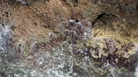 Top Down over Waves crashing on the rocks, Cliffs of Majorca, Spain, Europe Stock Footage 217441231