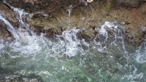 Top Down over Waves crashing on the rocks, Cliffs of Majorca, Spain, Europe Stock Footage 217441245