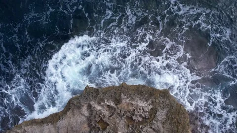 Top Down over Waves crashing on the rocks, Cliffs of Majorca, Spain, Europe Stock Footage 217589591