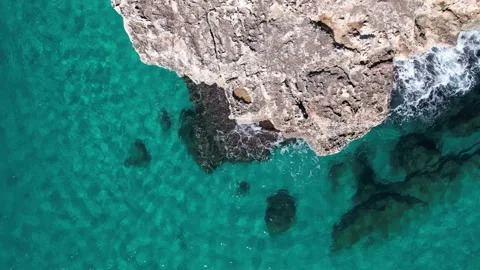 Top Down over Waves crashing on the rocks, Cliffs of Majorca, Spain, Europe 動画素材 217609567