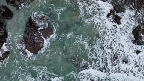 Top Down over Waves at storm in slow motion from a drone, St. Agnes, Cornwall Video stock 280090479