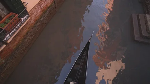 Top down overhead angle of a gondola passing along a canal through frame in 스톡 동영상 128318902