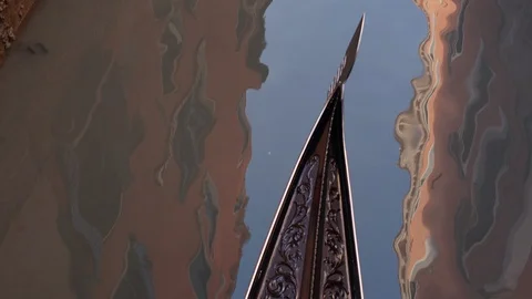 Top down overhead angle of a gondola passing along a canal through frame in Stock Footage 128319322