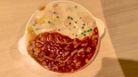 Top down overhead view of shrimp and chicken fried rice in creamy tomato sa.. Video stock 318268658