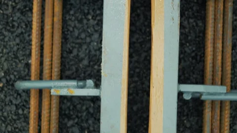Top-down overhead view of structural steel rebar grid and framework Stock Footage 348639303