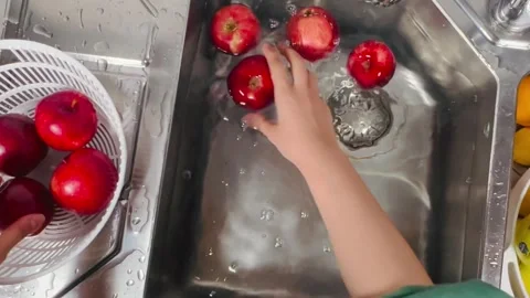 Top-Down Overhead View of Washing Fresh Organic Red Apples in Kitchen Sink Stock Footage 337730200