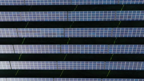 Top-Down Pan Across Solar Farm Patterns, Emphasizing Clean Energy Systems Stock Footage 300939515