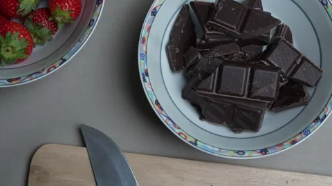 A top down panning shot of the uncut ingridients for a chocolate fondue with the Stock Footage 346238198