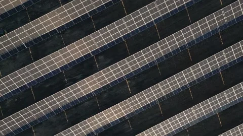 Top down panning view man worker working at solar power station drive tract.. Stock Footage 295419185