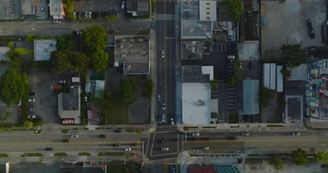 Top down panning view of traffic on roads in urban borough. Rectangular street Stock Footage 194590454