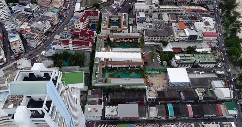 Top-Down Patong Rooftops, Pools and Main Road Vídeo Stock 71302118