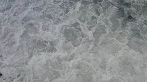 Top-Down Perspective of Foamy Waves Splashing onto a Philippine Coastal Stock Footage 250927730