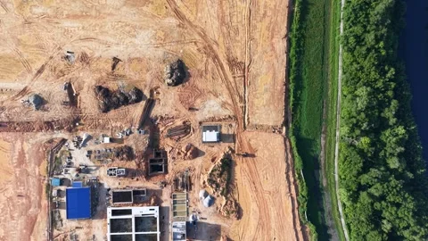 Top-down perspective reveals a construction site with dirt tracks Stock Footage 342650021