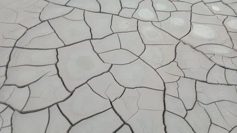 Top Down Perspective View of Dry Cracked Clay Mud and Drought Polygon Patter Stock Photos