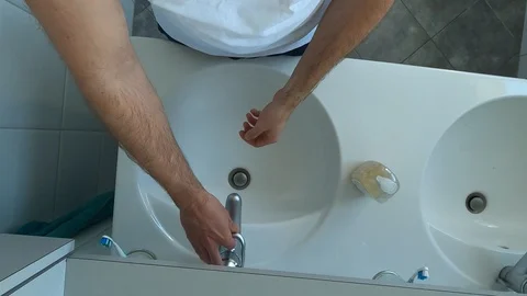 Top down point of view washing hands thoroughly in the bathroom, first person Stock Footage 127099929