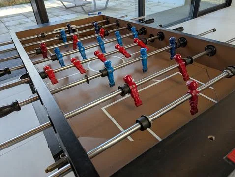 A top down portrait of a foosball table in a bar or caf, all the minature p.. 库存照片