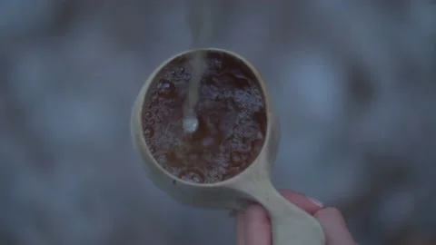 Top down pouring hot steaming water into traditional wooden mug Video stock 146270408