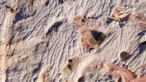 Top down prone flight of the rock formation of White Pocket in the Vermillion Cl Stock Footage 247674217