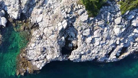 Top Down Pullback Over White Rocks and Blue Water Stock Footage 340508857