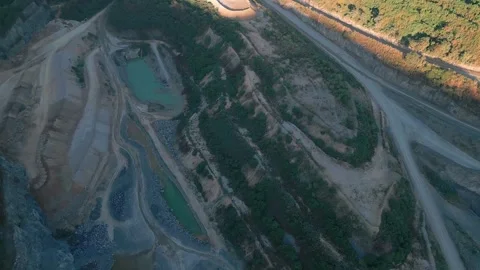 Top down quarry haul roads and sediment ponds Brasília DF Brazil mining aerial Stock Footage 335387561