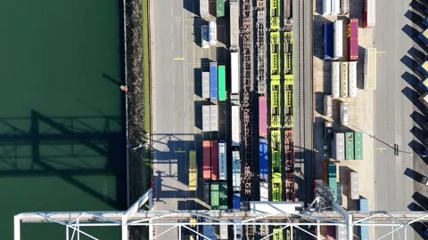 Top down rail yard with crane and green water Video stock 331896776