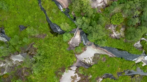 Top down rising aerial over bridge and creek in Norway Stock Footage 283268250