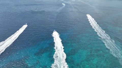 Top Down Rising drone shot of three boats racing Stock Footage 282483807