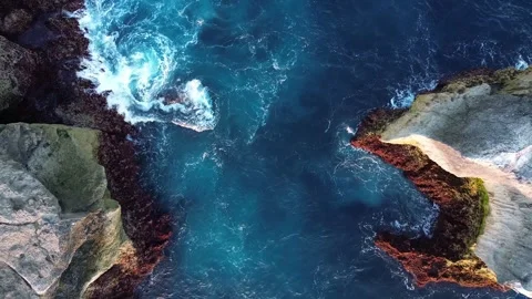 Top Down Rising Drone Shot of Narrow Ocean Channel Between Sea Cliffs Vídeos de archivo 345827240