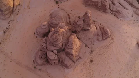 Top down rock formation in desert sand. Sunset. Aerial 4K Stock Footage 196839622