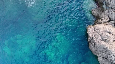 Top Down Rocky Coast and Turquoise Water Greece Stock Footage 336839564