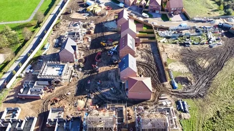 Top down rotating view of a house building construction site Video stock 343011001