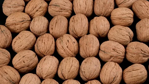 Top-Down Rotating Whole Walnuts In Shell Macro Texture Background Stock Footage 332528437