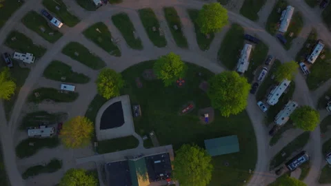 Top Down RV Campground Wisconsin: Radial Campsites Pool and Playground at Dusk Stock Footage 339644939