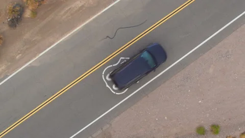 TOP DOWN: Scenic Route 66 crossing the rugged landscape of rural California, USA Stock Footage 156423571