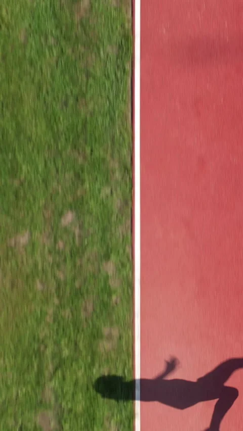 Top Down Shadow Of Athlete Performing Long Jump At Stadium 스톡 동영상 331367138