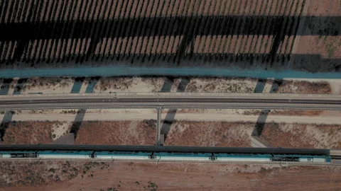 Top down shot of 2 trains crossing next to each other on a massive railway Video stock 209294762