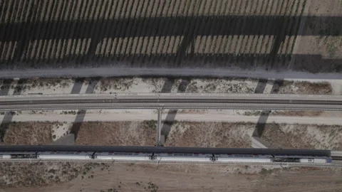 Top down shot of 2 trains crossing next to each other on a massive railway Video stock 209299976