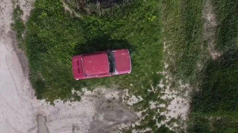 Top down shot of an abandoned car in the middle of a field 動画素材 167615740