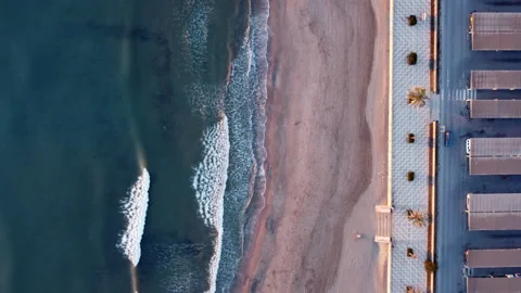 Top down shot of the beach next to a road Stock Footage 258296852
