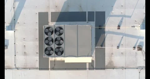 Top-down shot captures rooftop AC unit with six fans Stock Footage 337327245