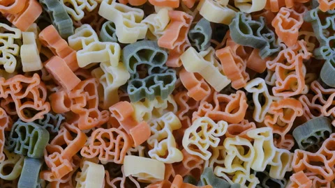 Top-down shot of a colorful assortment of pasta in various shapes and sizes 動画素材 285941865