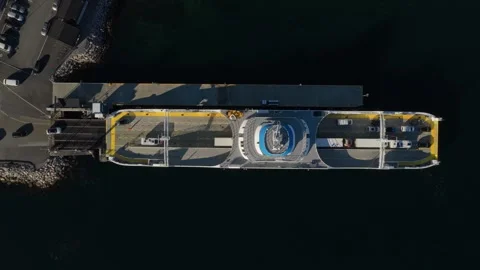Top-down shot of ferry being loaded with cars at coastal Norway port Stock Footage 320731104