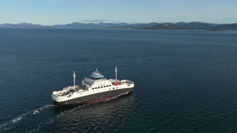 Top-down shot of ferry cruising away from Norwegian island Smola Stock Footage 320576804