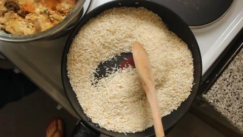Top-down shot of fluffy rice in a pan. Stock Footage 303722285