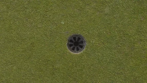 Top down shot of golf ball being putted from 2 feet Stock Footage 104564000