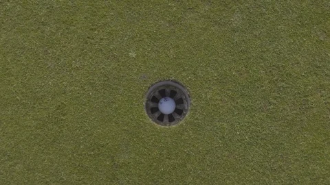 Top down shot of golf ball being putted Stock Footage 104564014